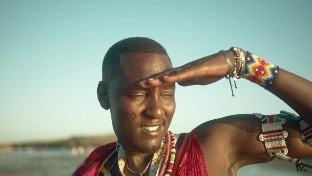 Male Maasai Warrior Searching For Enemies In Masai Mara, Kenya. closeup