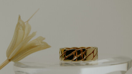 gold ring on glass, jewelry concept