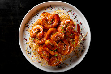 Whole fried big shrimps with seasonings in plate