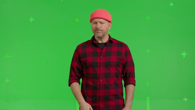 Man saying no by shaking his head . Serious male model showing a prohibition gesture with his hands on Green Screen, Chroma Key. 4k video footage