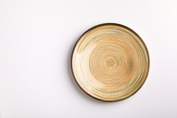 Plate on the white background. Brown plate.