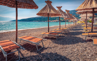 Empty Baska Beach at the morning. Bright summer seascape of Adriatic sea, Baska town location, Krk island, Kvarner bay archipelago, Croatia, Europe. Vacation concept background..