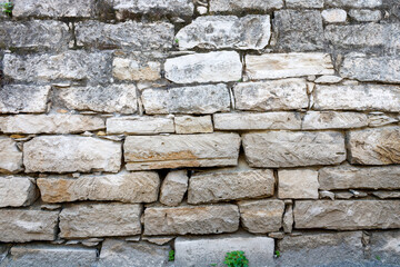 Old natural brick stone wall texture background 