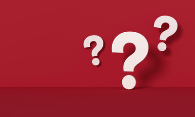 Three white question marks in front of a red wall background.