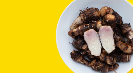 Boiled taro on yellow background.