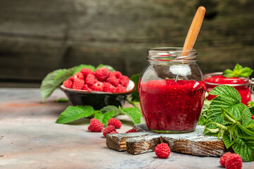 Raspberry jam with berry on light background. Homemade jam with raspberry. banner, menu, recipe place for text, top view