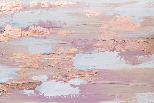 Painting focus on the colors and textures of gold and white strokes set against the warm beige-pink hue of the background. The brushwork a sense of energy and movement. Modern and sophisticated art.