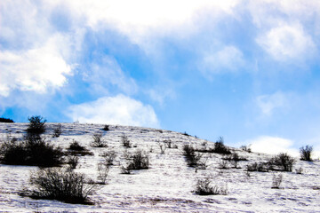 Fototapeta na wymiar Mountain covered with snow in winter.