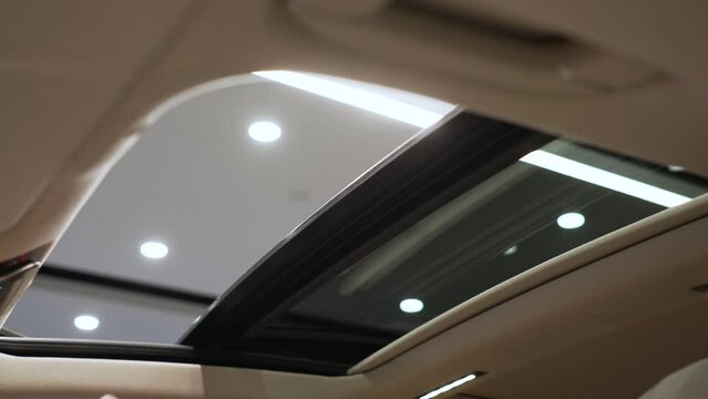 In a premium car, a glass roof or sunroof opens.