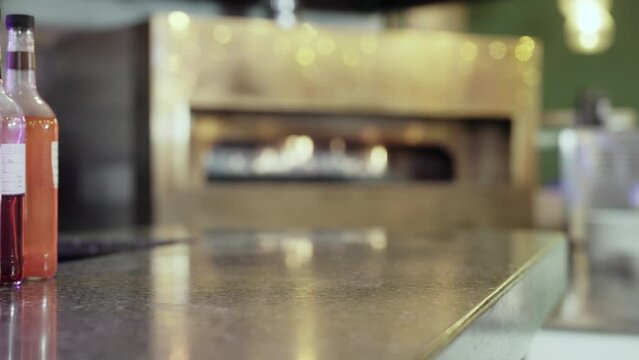 Cocktail being removed and replaced onto the restaurant bar v1