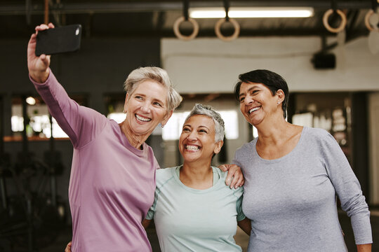 Selfie, friends and senior women in gym taking pictures for happy memory together. Sports, laughing and group of retired females taking photo for social media post after workout, training or exercise