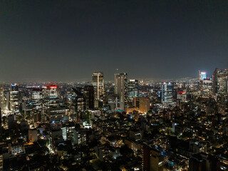 Fototapeta premium Beautiful aerial view of the capital of Mexico city at night.