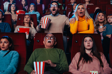 Shocked spectators in movie theater.