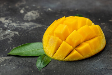 Mango tropical fruit on dark background. superfood concept