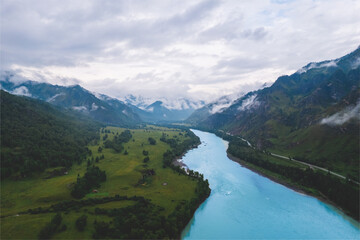 Naklejka na ściany i meble Altai mountains summer Russia, aerial top view. Blue Katun river with fog mood