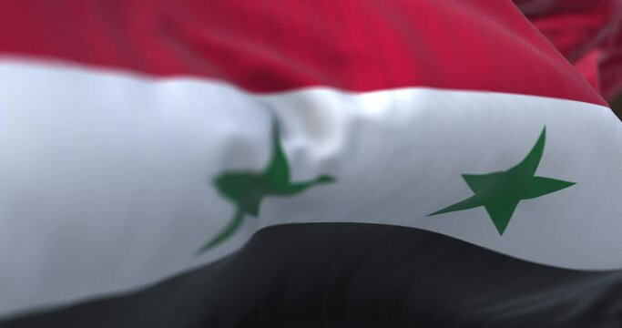 Detail of the Syria national flag waving