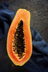Papaya piece on a black table