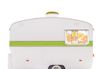 Vintage seventies white caravan with flower curtains