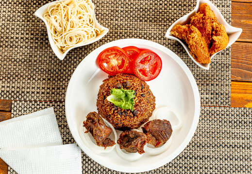 jollof with red chili paste and chicken and meat