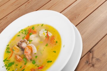 Delicious hot soup dish in plate