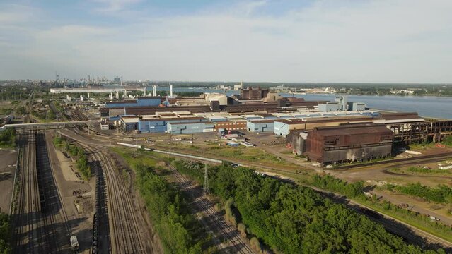 Great Lakes Steel company with Detroit city skyline in background, aerial view