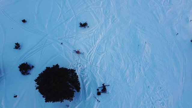 Aerial view of rescue of injured person in ski station