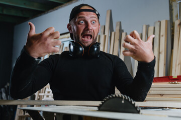 An emotional portrait of a carpenter who imitates severed fingers. The danger of a circular saw,...