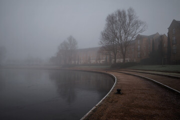 Heavy fog at Caldecotte lake on winter morning 