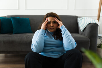 Depressed anxious woman suffering a headache