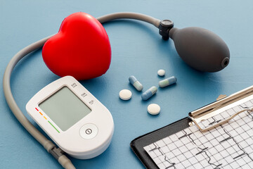 Red heart and blood pressure monitor. Heart diseases diagnosis concept