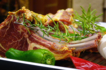 Rack of lamb with garlic, rosemary, and spices. Homemade food.