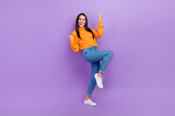 Fototapeta na wymiar Full body photo of cheerful lady raise fists up enjoy incredible win discounts isolated purple color background