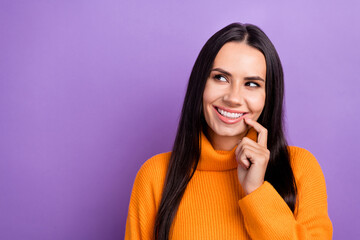 Portrait of nice positive person toothy smile finger touch lips look empty space isolated on purple...