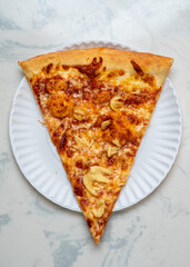 Slice of pizza with garlic