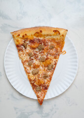 Slice of pizza with sausage