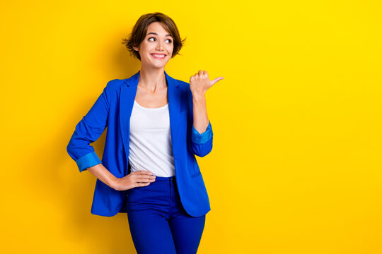 Photo of professional hr manager recruiter wear blue jacket looking opening new it company demonstrate brand isolated on yellow color background