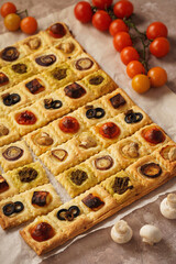 Puff pastry mini pies with cherry tomatoes, mushrooms, olives , feta cheese and onion.