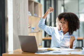 happy African woman Businesswoman, manager, or freelancer working remotely from home, enjoying...