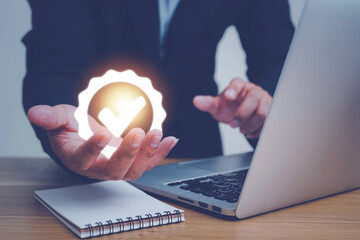 Hand shows the sign of the top service Quality assurance, ISO certification and standardization concept, Standard quality control certification assurance guarantee, Concept. Guarantee, Standards