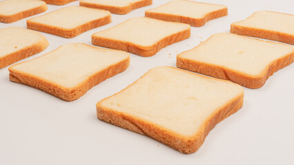 Delicious bread slices isolated on a white background, top view.
