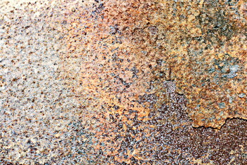 Old metal surfaces covered with rust and paint residue. Rust patterns as base and background.