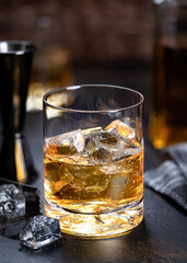 Glass of whiskey with ice