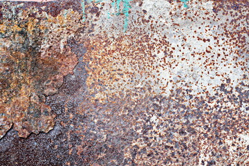 Old metal surfaces covered with rust and paint residue. Rust patterns as base and background.