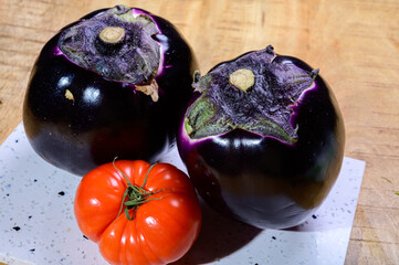 Fresh ripe sicilian purple globe Violetta eggplants vegetables ready to cook, healthy Italian food