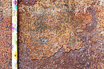 Old metal surfaces covered with rust and paint residue. Rust patterns as base and background.