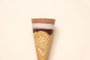 Delicious chocolate ice cream cone, summer dessert on white background. Cool minimal flat lay, copy space