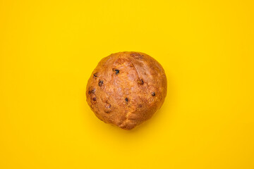 Fototapeta premium Panettone typical Italian Christmas cake on a yellow background. Cool minimal flat lay copy space