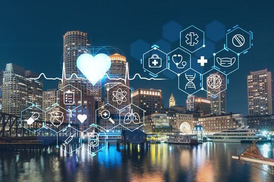 City view panorama of Boston Harbor and Seaport Blvd at night time, Massachusetts. Financial downtown. Glowing healthcare digital medicine icons. The concept of disease treatment, threat of pandemic