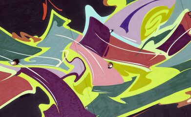 Colorful background of graffiti painting artwork with bright aerosol strips on metal wall. Old...