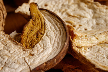 Close up of dried porcini mushrooms. Food and wooden background. Rustic style.